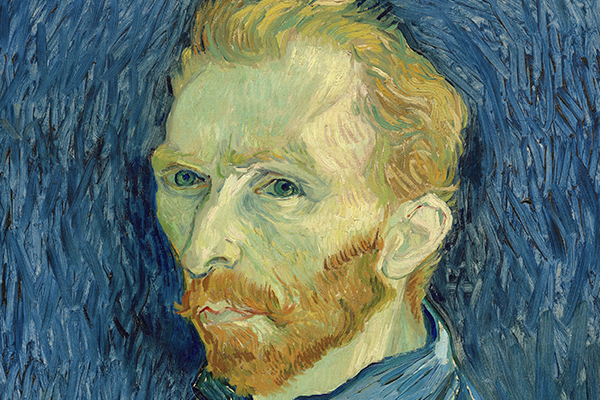 a man's face looks out at us. He has golden hair and a beard, which is contrasted with the deep blue swirls in the background